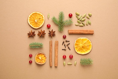 Photo of Flat lay composition with mulled wine ingredients and fir branches on brown background