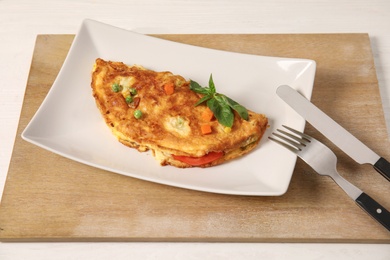 Photo of Plate with tasty omelet served for breakfast
