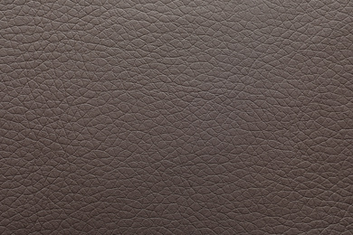 Texture of dark leather as background, closeup