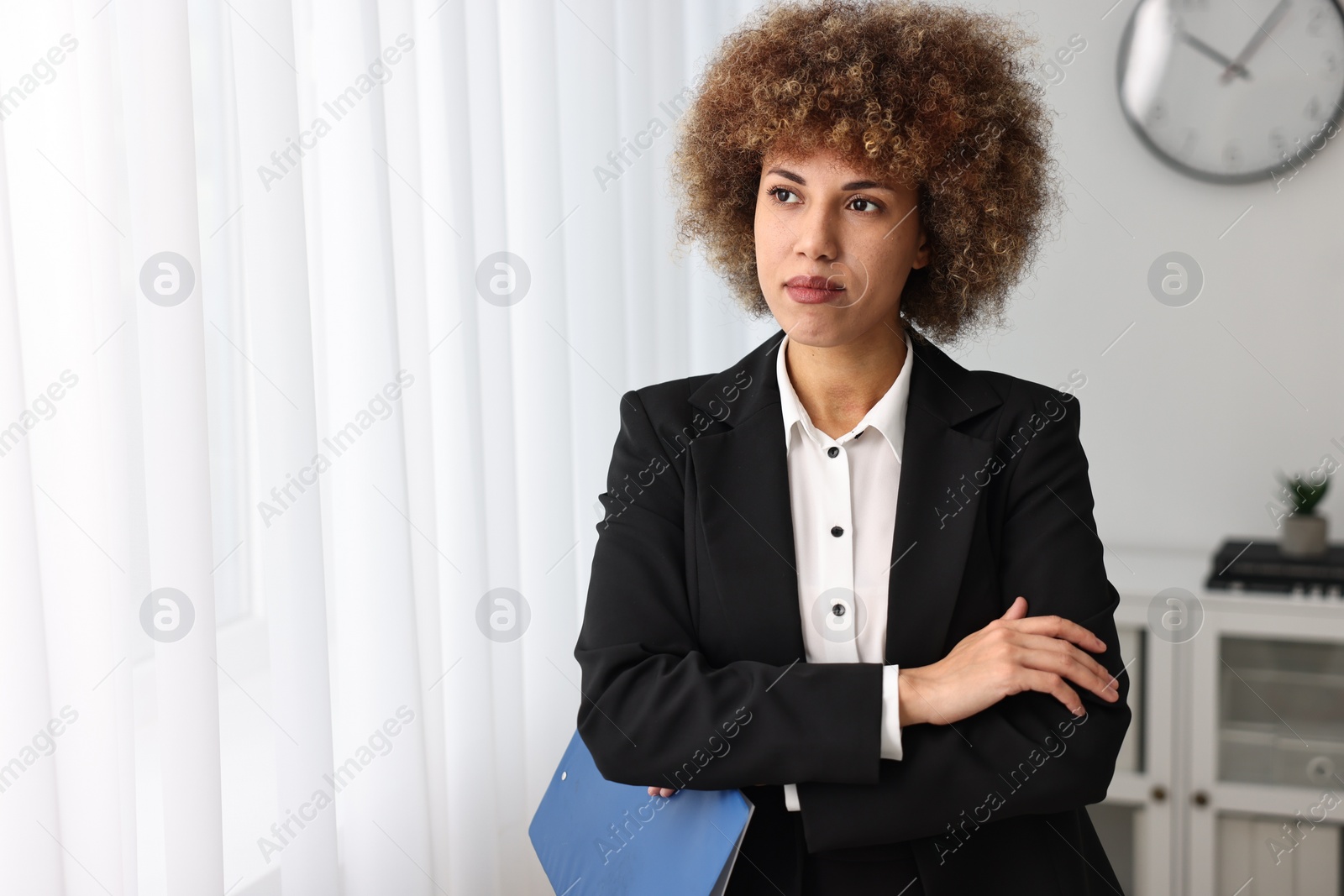 Photo of Beautiful female notary with clipboard in office, space for text