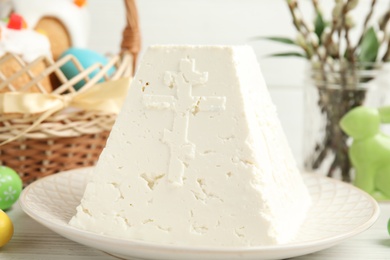 Photo of Traditional cottage cheese Easter paskha on white table, closeup