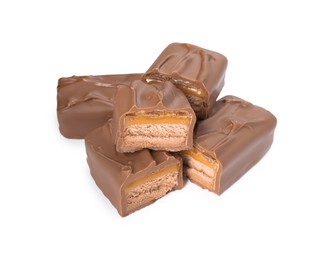 Photo of Pieces of tasty chocolate bars with nougat on white background