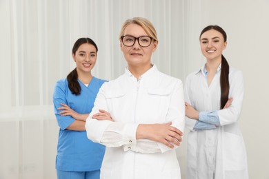 Photo of Portrait of medical doctors wearing uniforms indoors