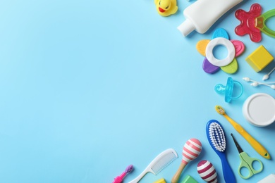 Photo of Flat lay composition with baby accessories and toys on color background. Space for text