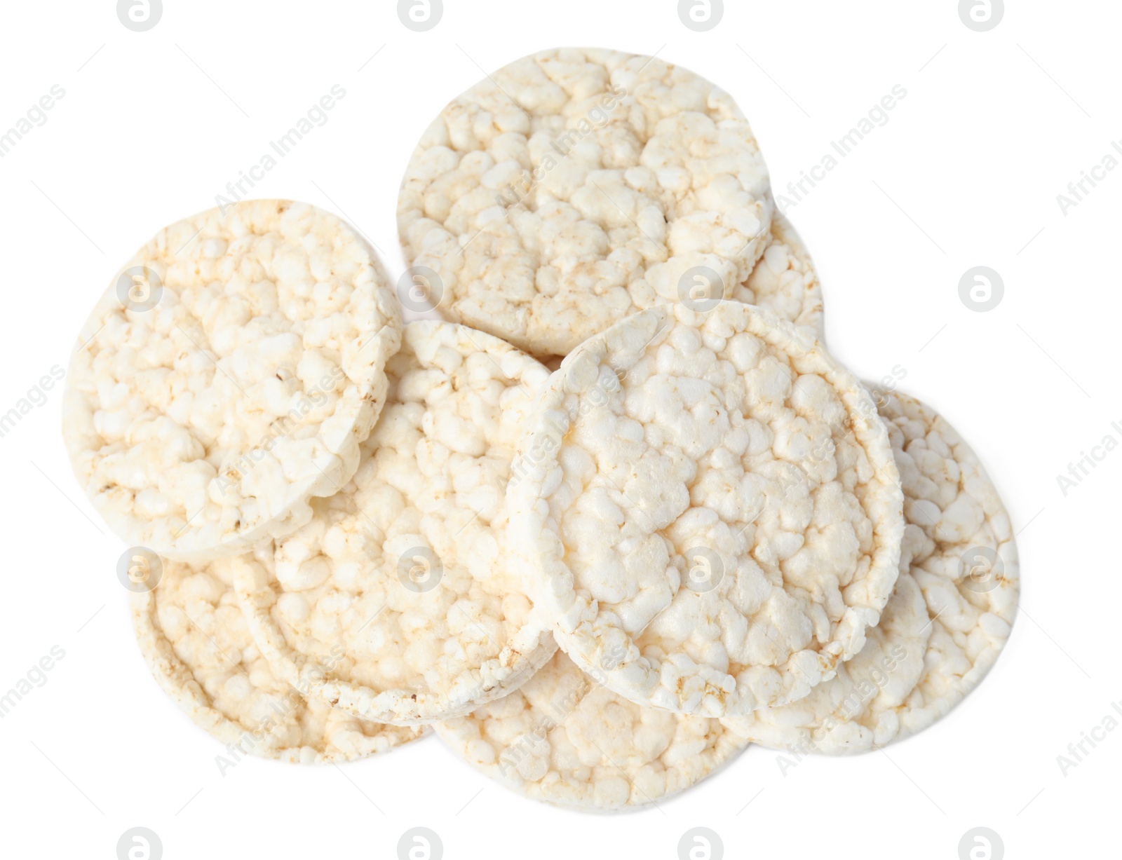 Photo of Pile of crunchy rice cakes isolated on white, top view