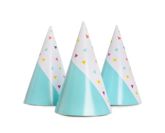 Photo of Bright birthday party hats on white background