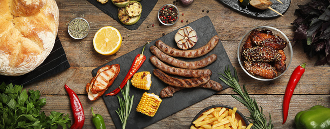 Image of Flat lay composition with barbecued meat and vegetables on wooden table. Banner design