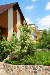 Photo of Landscape with modern house and beautiful garden on sunny day