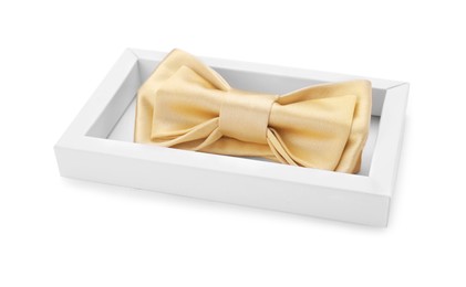 Photo of Stylish beige bow tie in box on white background