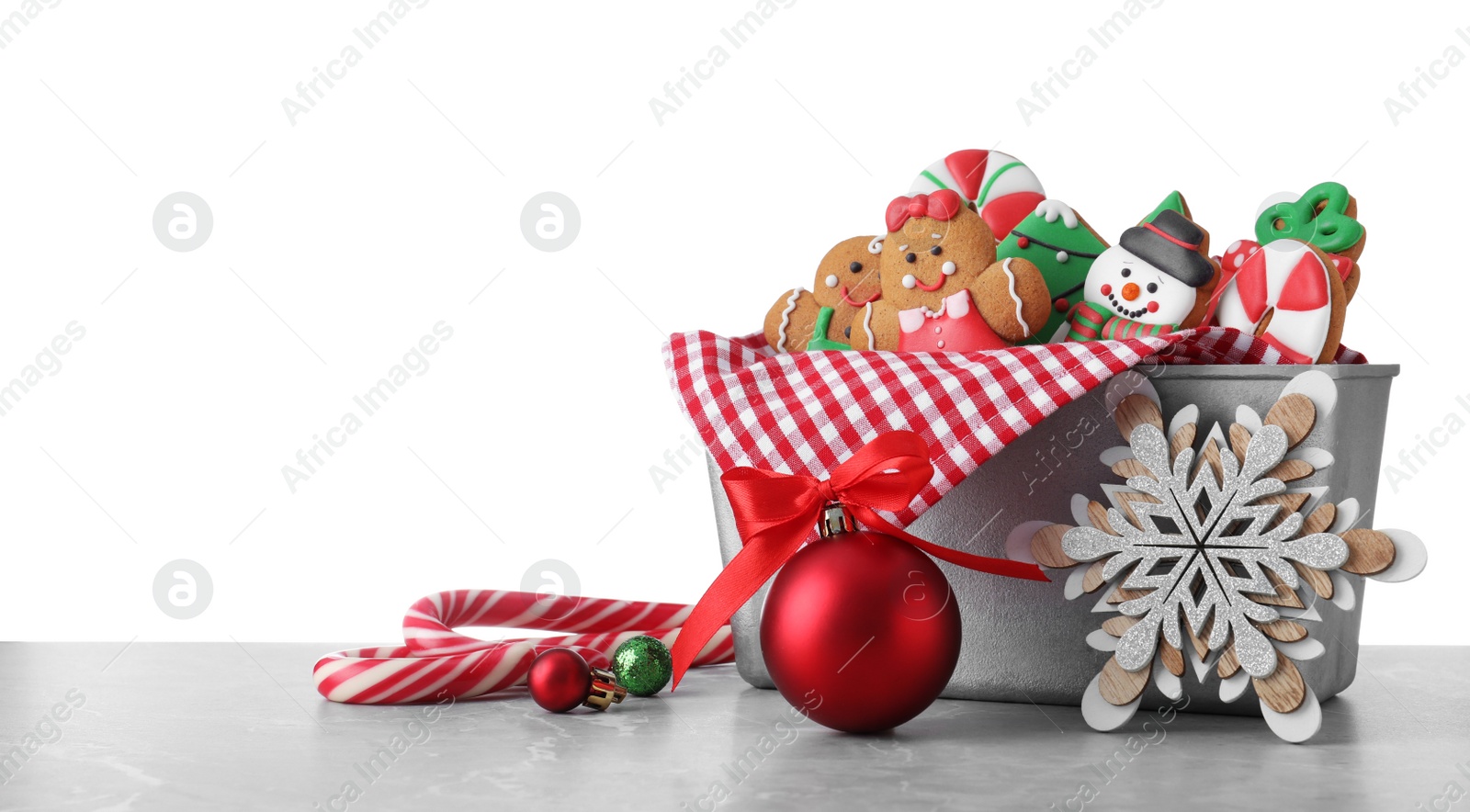Photo of Tasty Christmas cookies on light table against white background