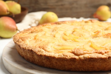 Delicious sweet pear tart on table, closeup