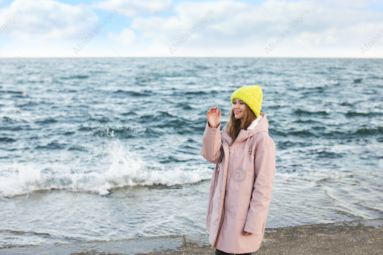 Photo of Portrait of beautiful young woman near sea