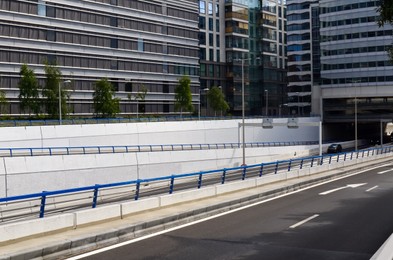 Photo of Beautiful view of road and city street with buildings on sunny day