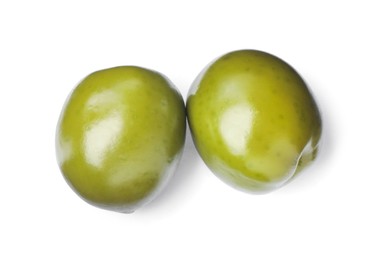 Photo of Two fresh green olives on white background, top view