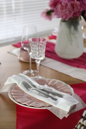 Photo of Beautiful table setting with pink color accent