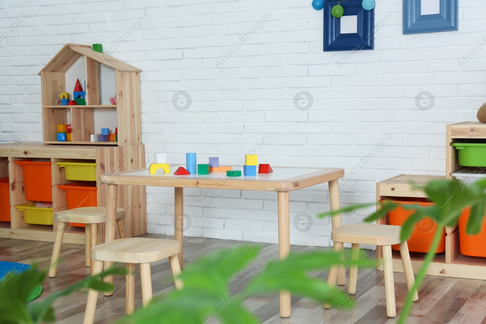 Photo of Modern child room interior with table and stools