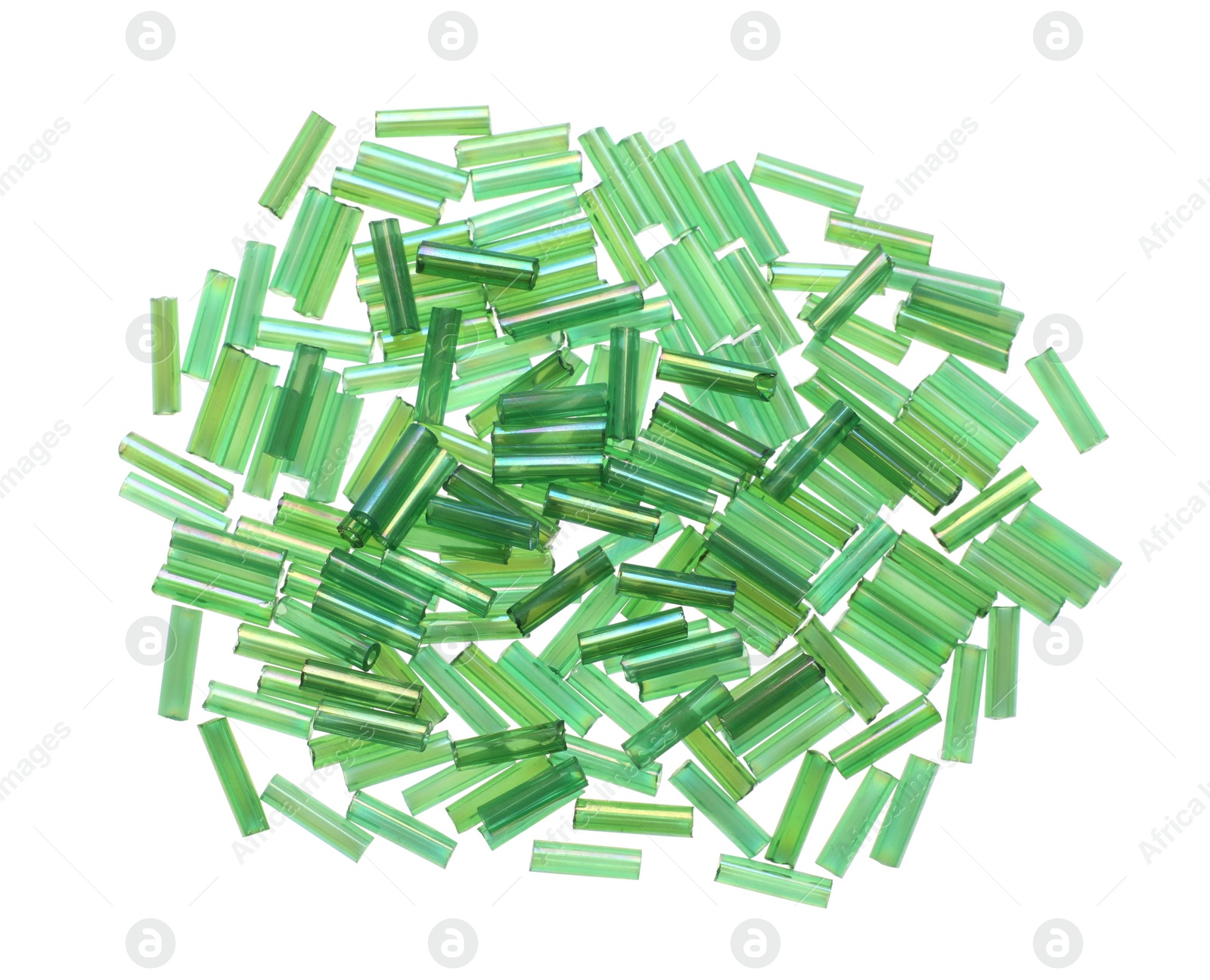 Photo of Pile of green bugle beads on white background, top view