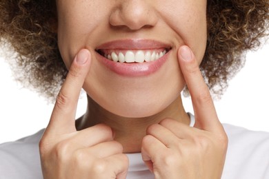 Photo of Woman showing her clean teeth and smiling on white background, closeup