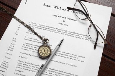 Photo of Last Will and Testament, glasses, pen and pocket watch on wooden table, flat lay