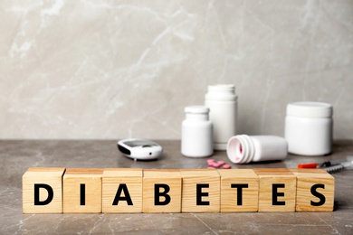 Photo of Word DIABETES made of cubes on table