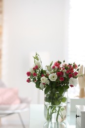 Photo of Glass vase with fresh flowers on dressing table indoors. Space for text