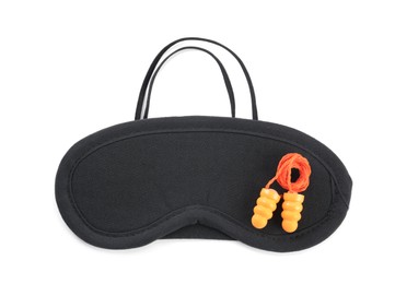 Photo of Pair of ear plugs and black sleeping mask on white background, top view