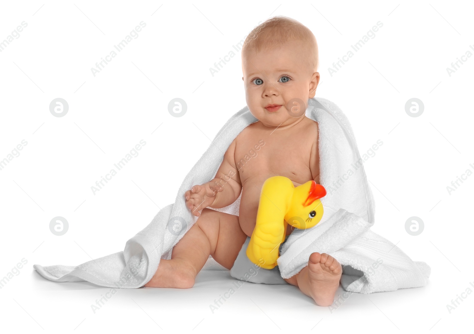 Photo of Cute little baby with soft towel and toy duck on white background