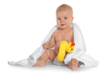 Photo of Cute little baby with soft towel and toy duck on white background