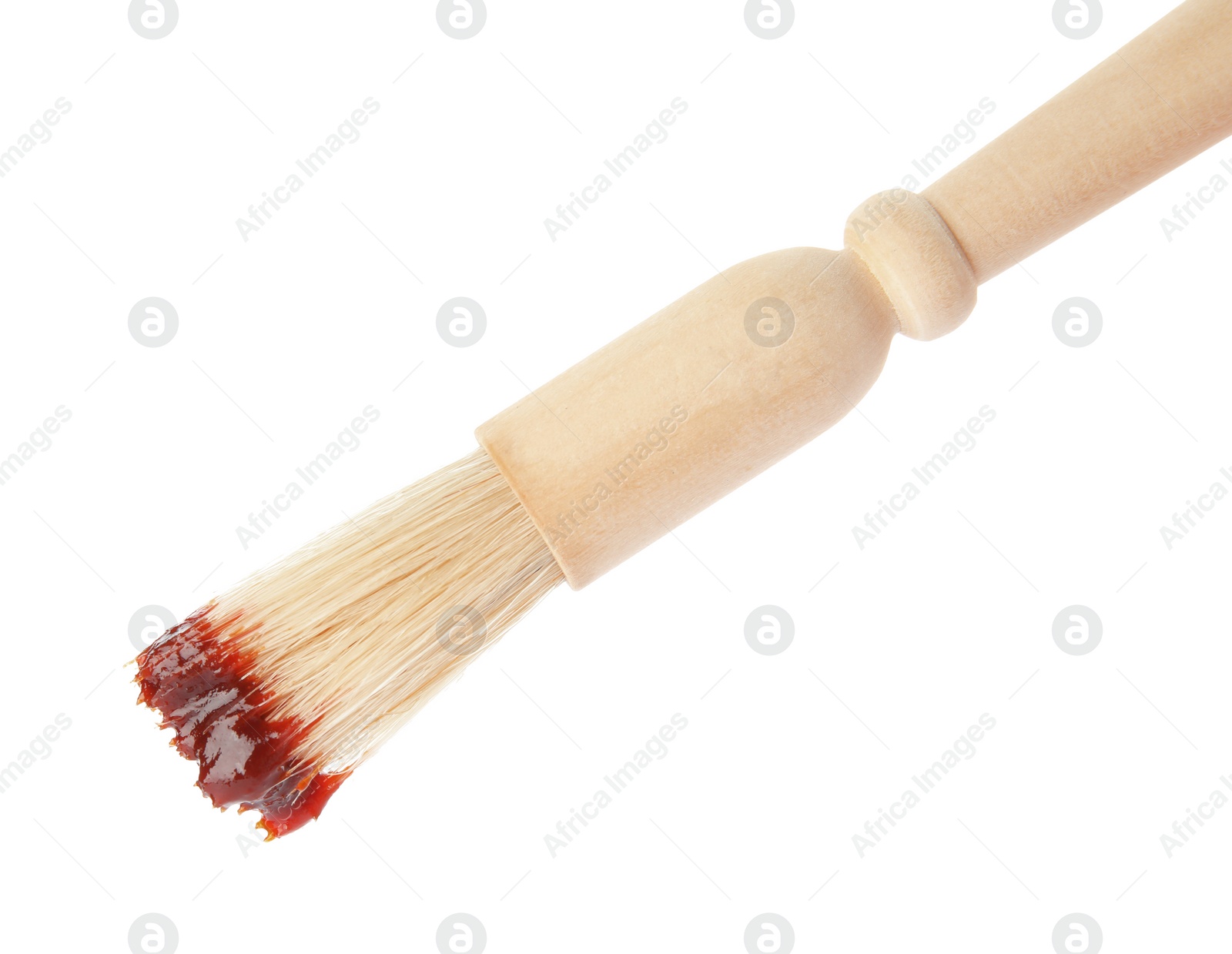 Photo of Basting brush with barbecue sauce on white background