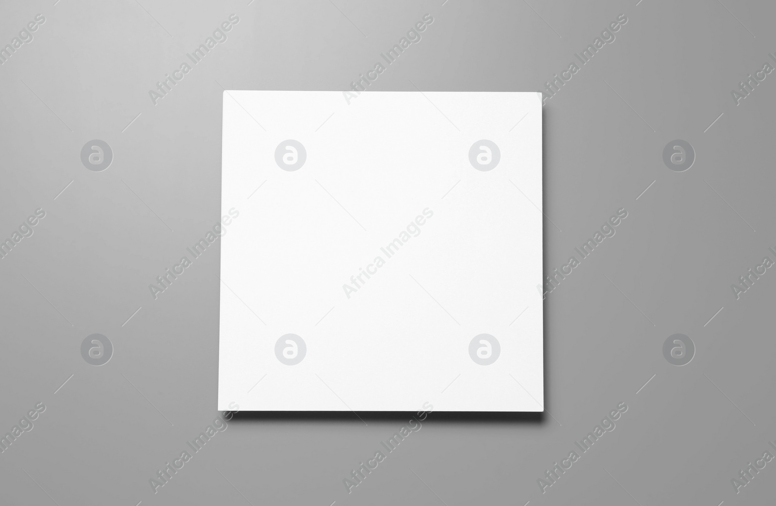 Photo of Blank paper sheets for brochure on grey background, top view. Mock up