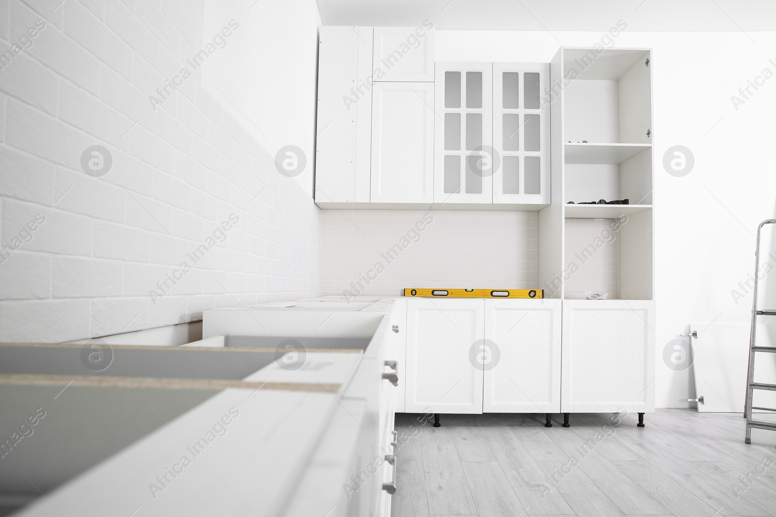 Photo of Stylish kitchen interior with newly installed furniture