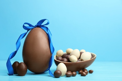 Photo of Composition with chocolate Easter eggs on table