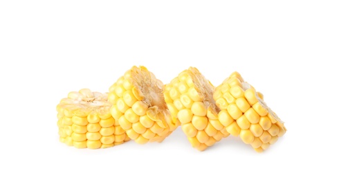 Pieces of ripe raw corn cob on white background