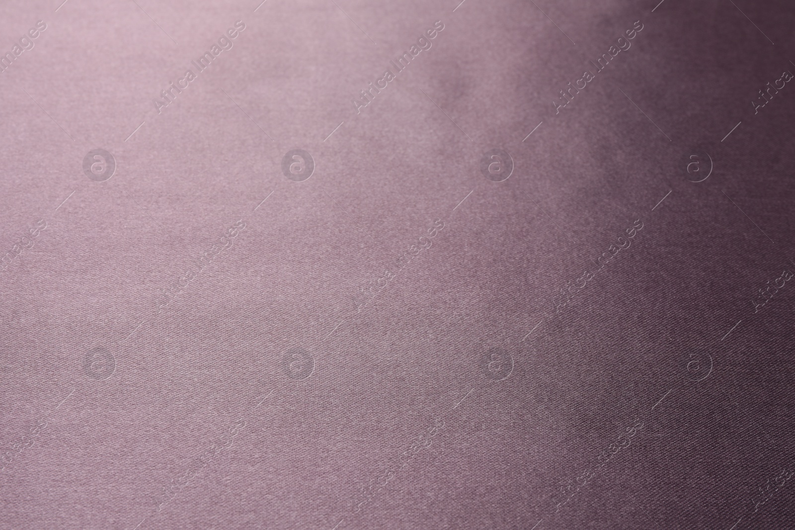 Photo of Dark purple silk fabric as background, closeup