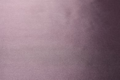 Photo of Dark purple silk fabric as background, closeup