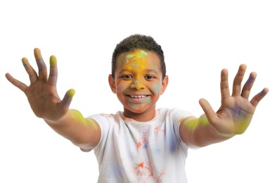 African American boy covered with colorful powder dyes on white background. Holi festival celebration