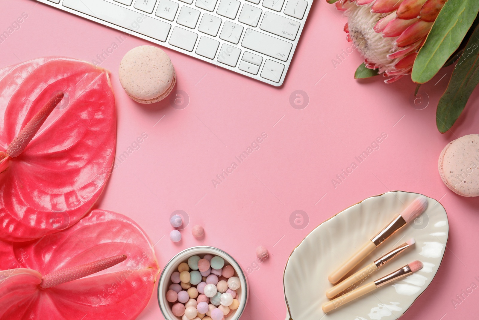 Photo of Creative flat lay composition with tropical flowers, computer keyboard and beauty accessories on color background