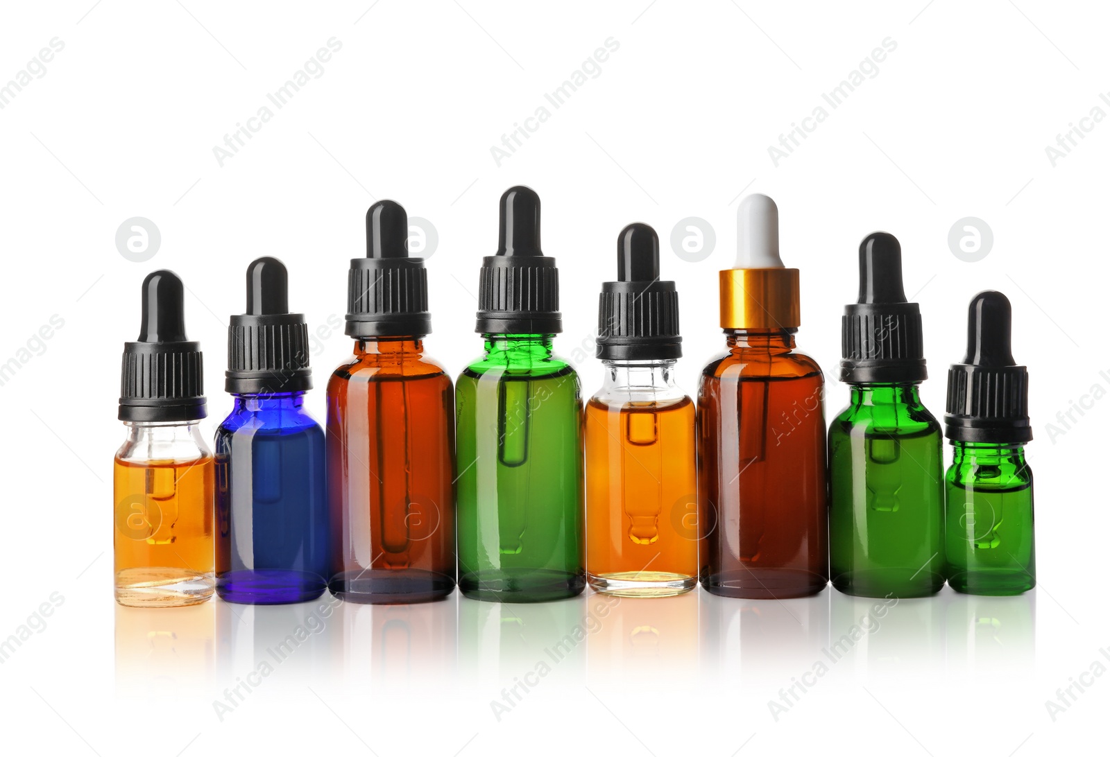 Photo of Cosmetic bottles of essential oils on white background