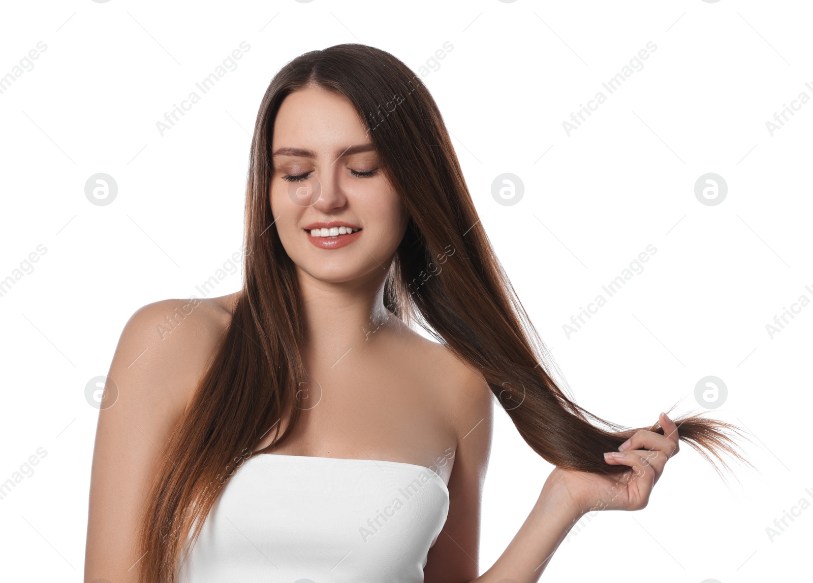 Photo of Young woman with strong healthy hair on white background