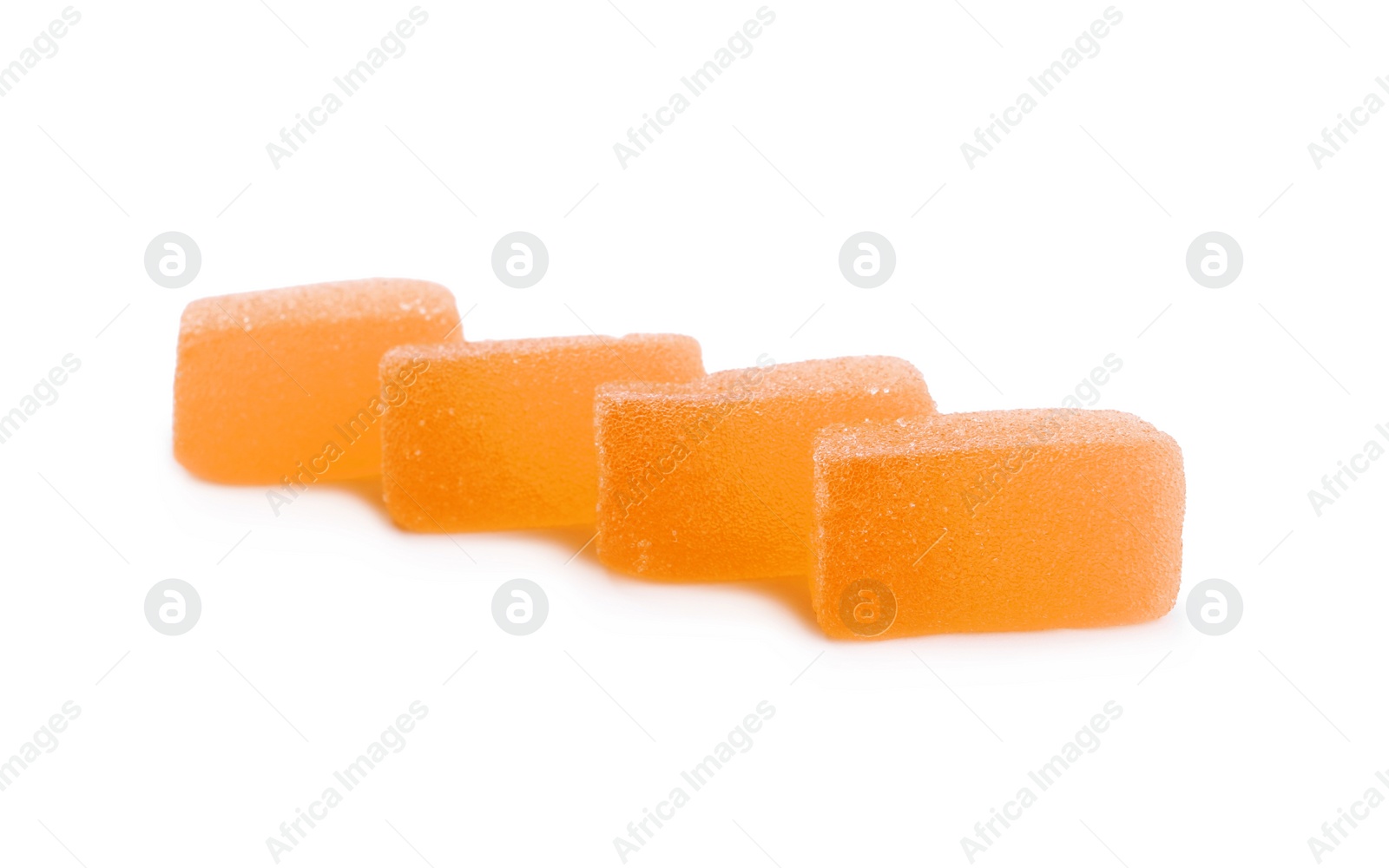 Photo of Tasty orange jelly candies on white background