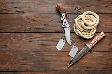 Set of military outfit on wooden background