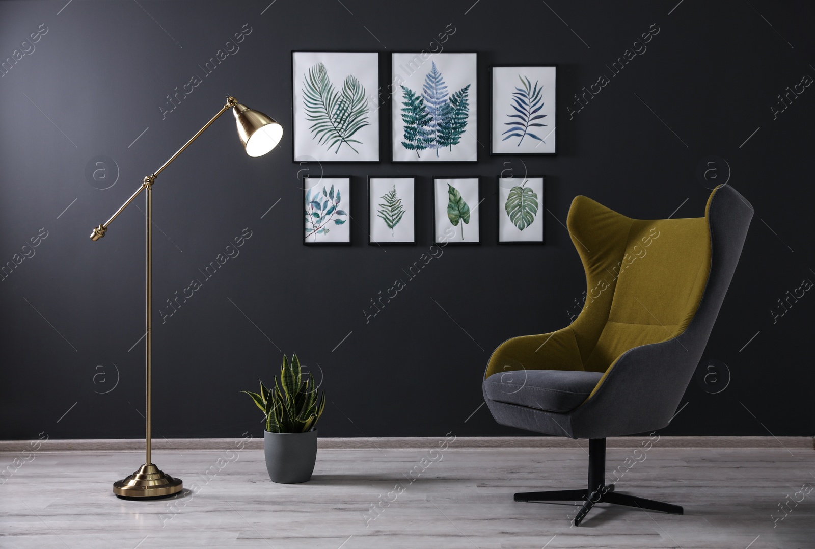 Photo of Comfortable armchair near black wall in room