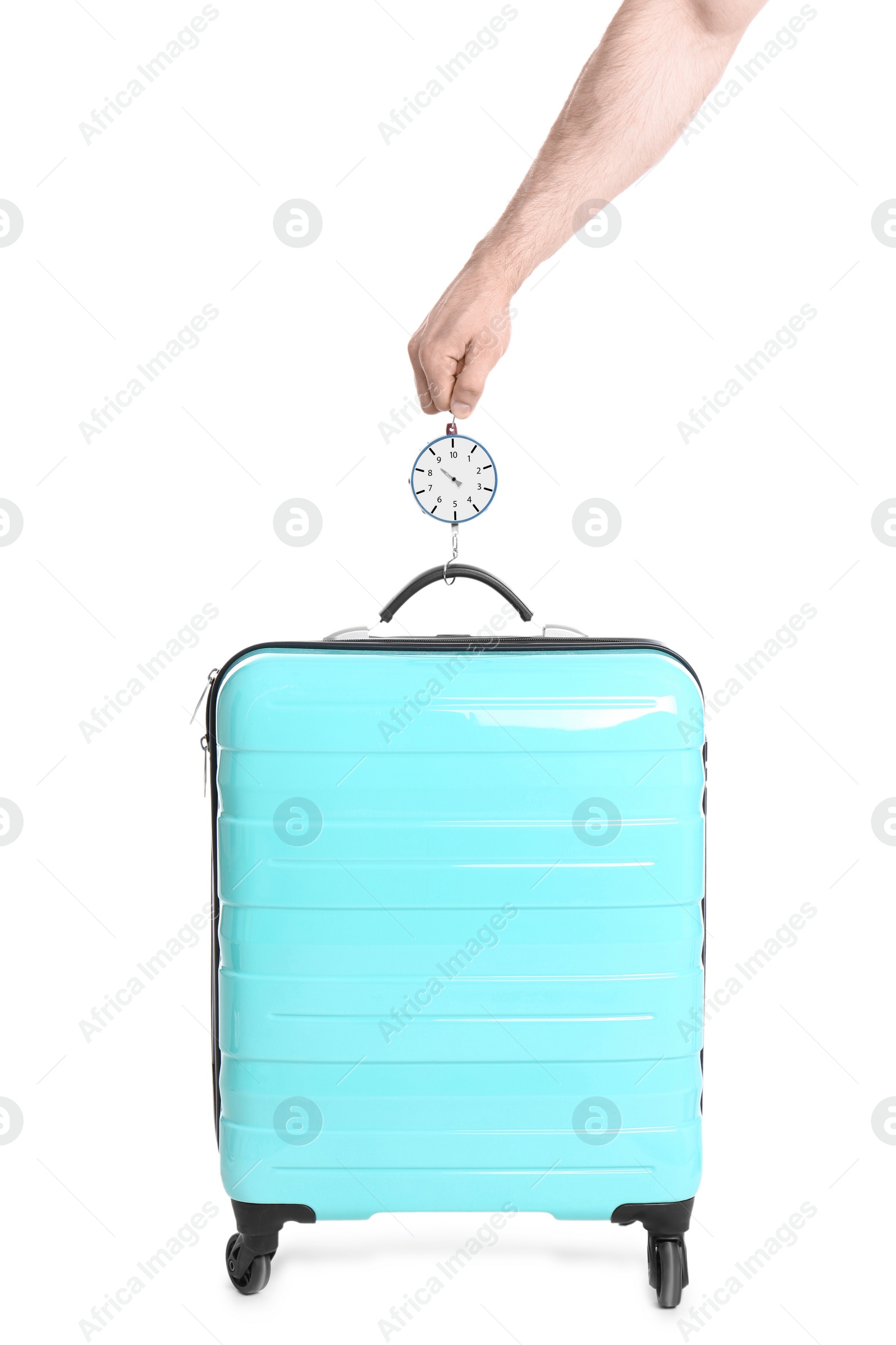 Photo of Man weighing stylish suitcase on white background