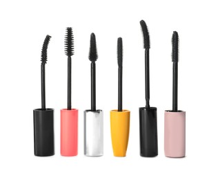 Many mascara wands for eyelashes on white background. Makeup product