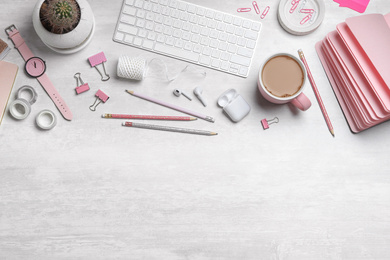 Flat lay composition with keyboard, stationery and accessories on white table, space for text. Designer's workplace