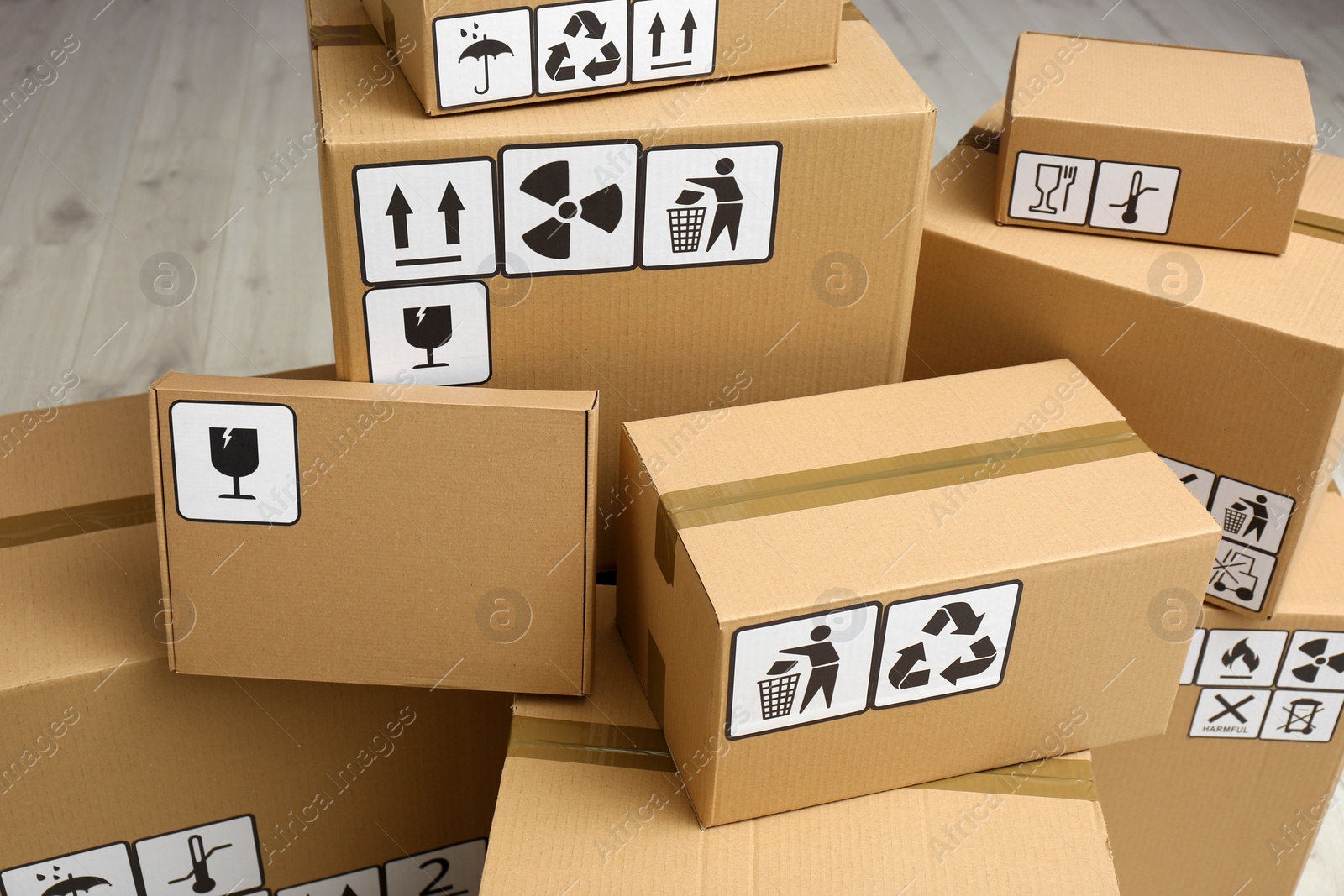 Photo of Cardboard boxes with different packaging symbols. Parcel delivery