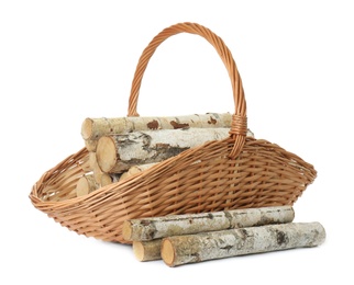 Photo of Wicker basket with firewood on white background