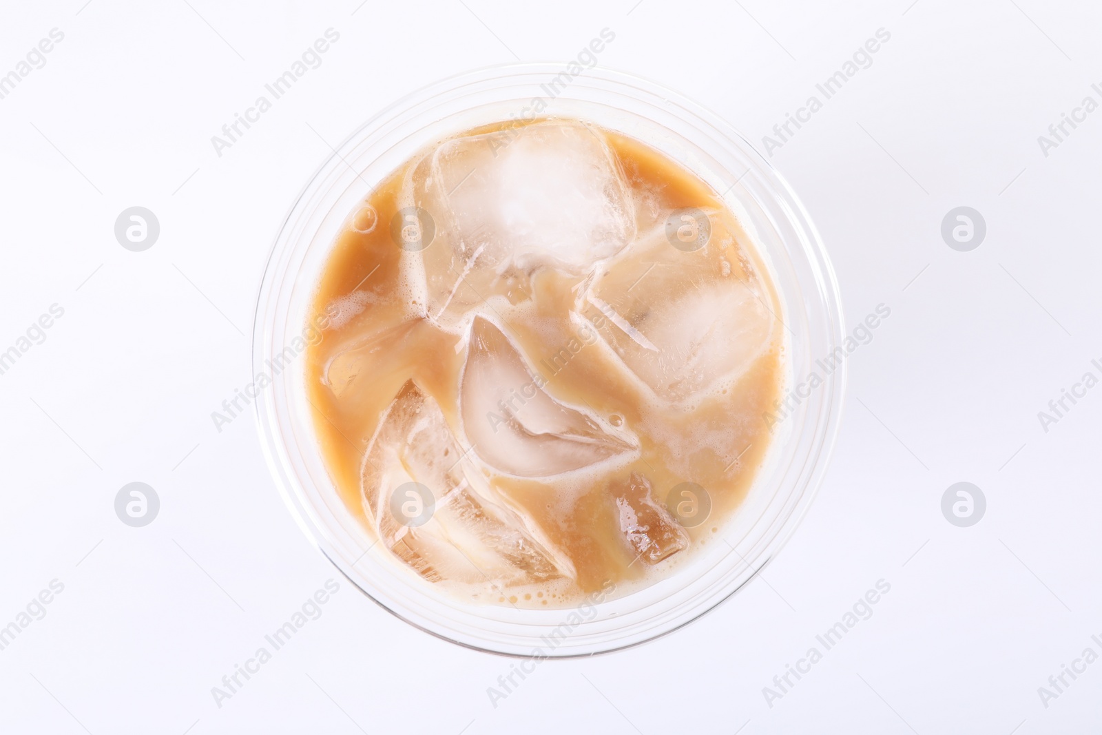 Photo of Plastic cup of fresh iced coffee isolated on white, top view