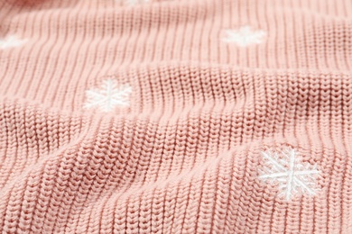 Photo of Texture of cozy warm sweater as background, closeup