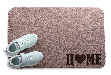 Image of Door mat with words Home and shoes on white background, top view